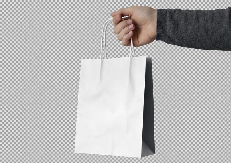 Hand Holding White Paper Bag on Transparent Background