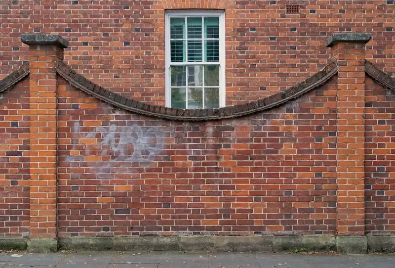 Classic Red Brick Fence with Window