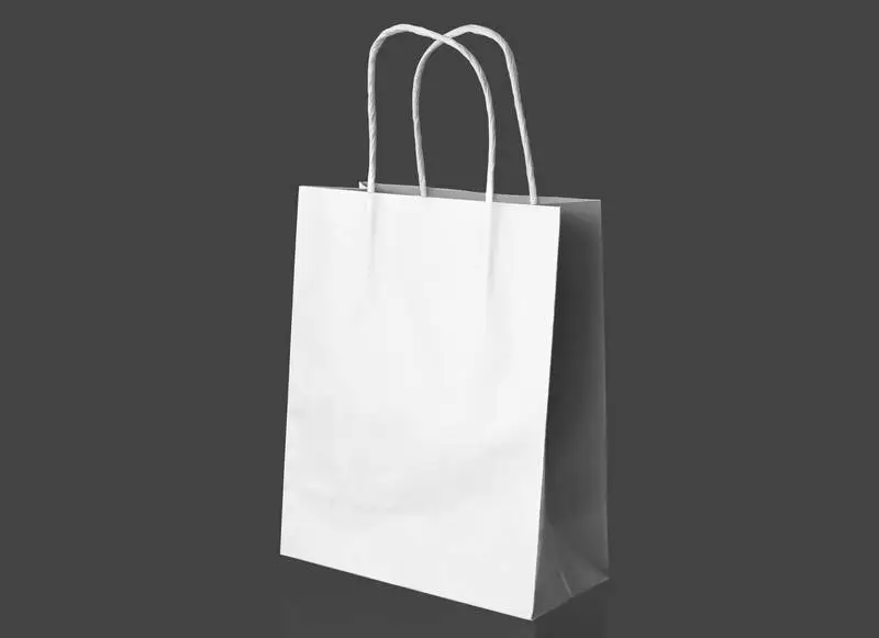 White Paper Bag Over Grey Surface
