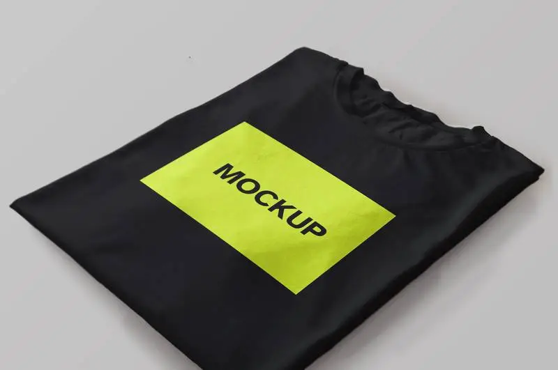 Mockup of a Black T-Shirt Folded with Perspective