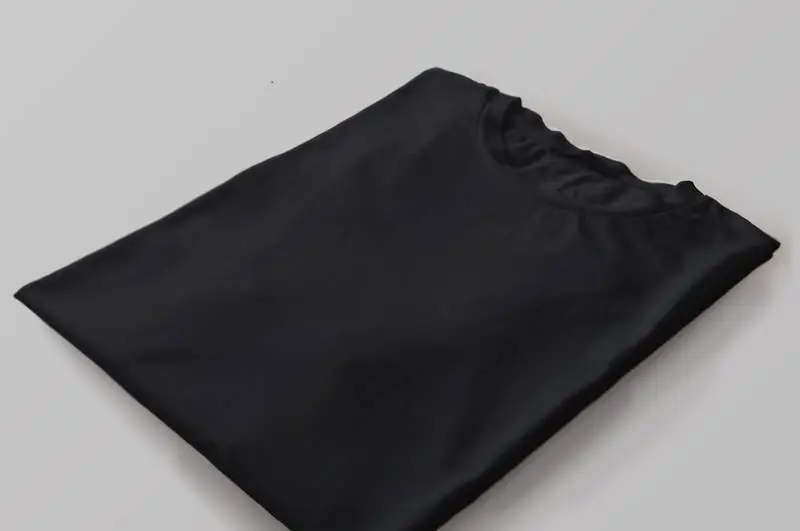 Photo of Black T-Shirt Folded with Perspective