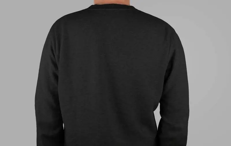 Photo of a Model on His Back Wearing a Black T-Shirt