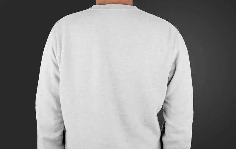 Photo of a Model with His Back to the Camera Wearing a White T-Shirt