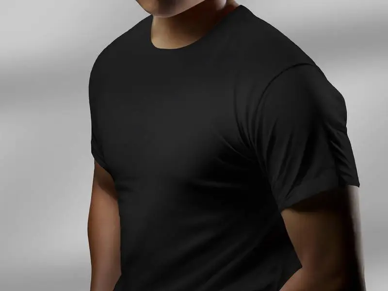 Photo of a Model in Three-Quarter Stance Wearing a Black T-Shirt