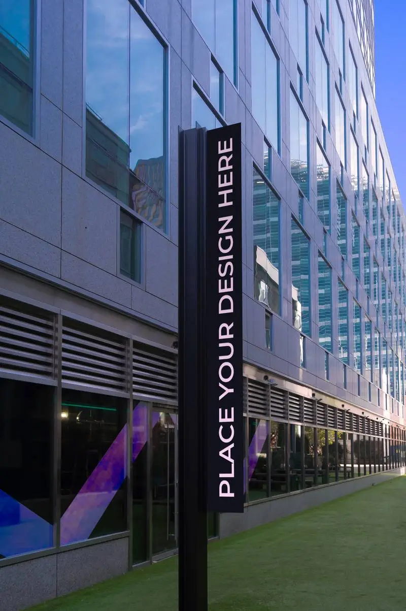 Mockup of a Vertical Metal Poster with a Modern Building Background