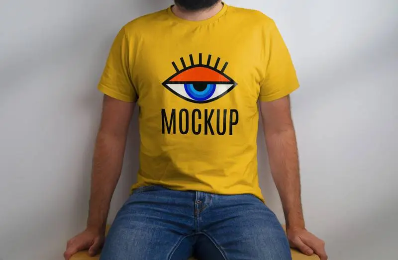 Mockup of Seated Model in Yellow T-Shirt