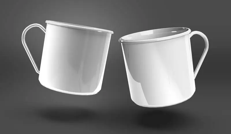 Pair of White Metallic Mugs Over Dark Surface