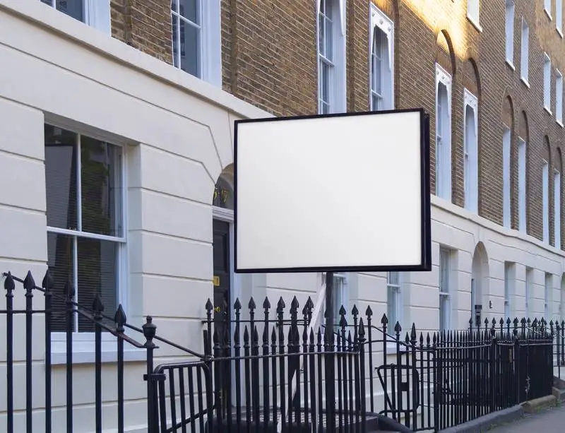 Photo of a White Poster on a MUPI on Grey Background