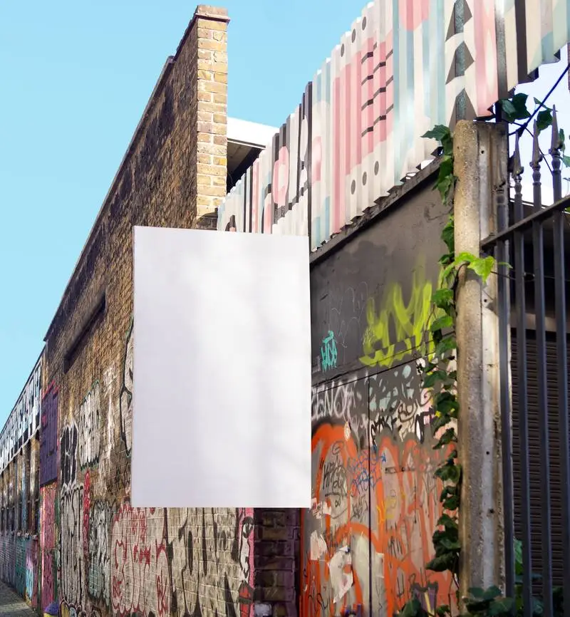 White Poster on Black Brick Wall