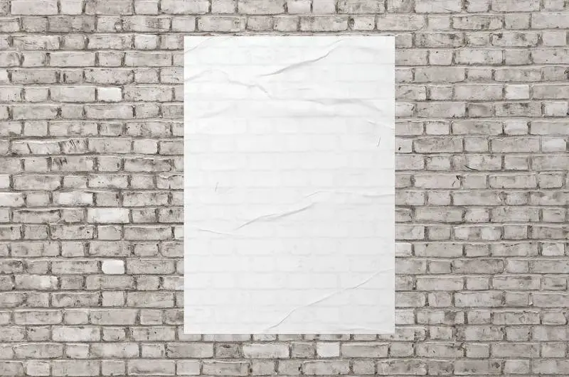 White Poster on White Brick Wall