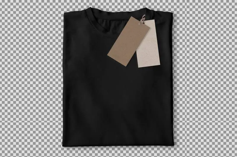 Photo of Folded Black T-shirt with Labels Over Transparent Surface