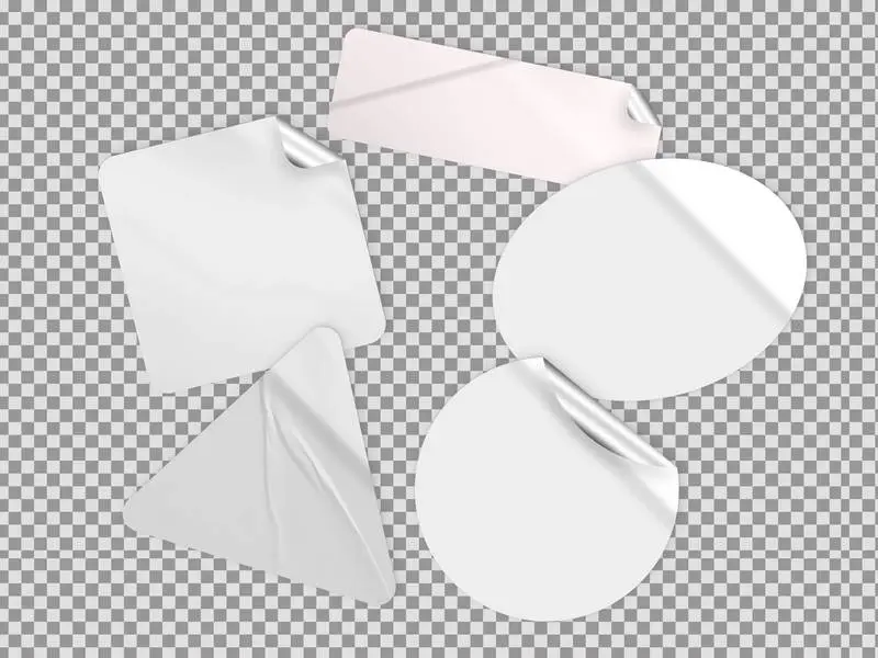 Set of White Stickers with Different Geometric Shapes Over Transparent Surface