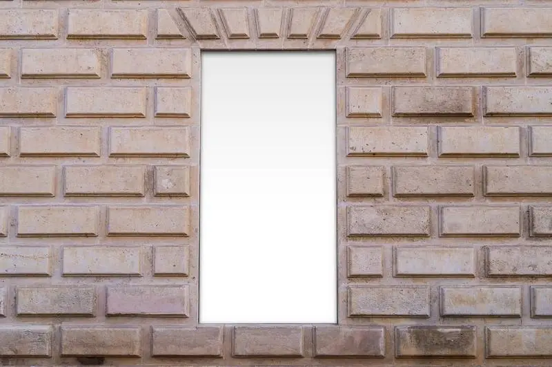 White Poster Photo in Niche on Classical Wall in Stone Building