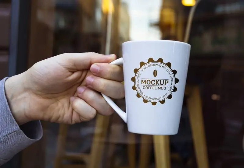 Mockup of White Coffee Cup Design in Outdoor Scene