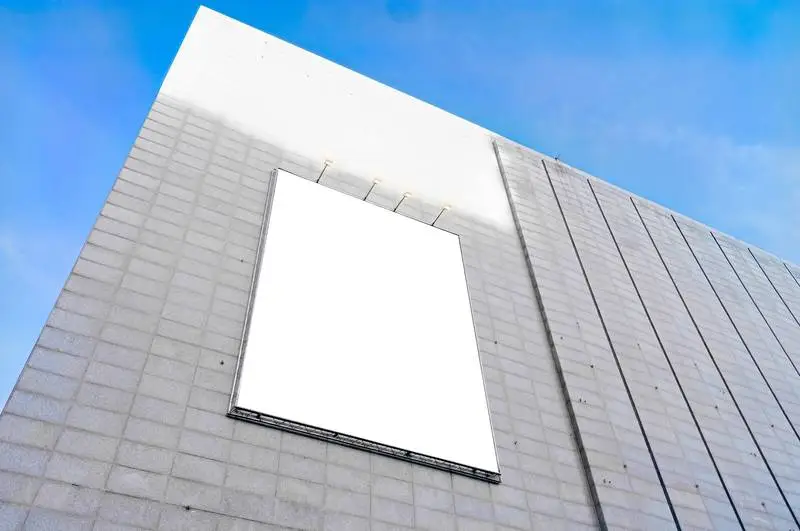 White Panel in Modern Building with Blue Sky