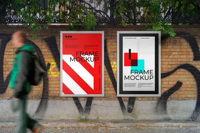 Mockup of Poster Pack with Metal Frame on a Brick Wall in the Street