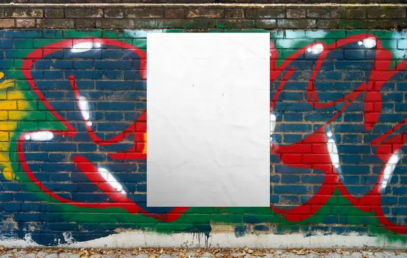 Photo of a Blank Poster Pasted on a Grunge Wall