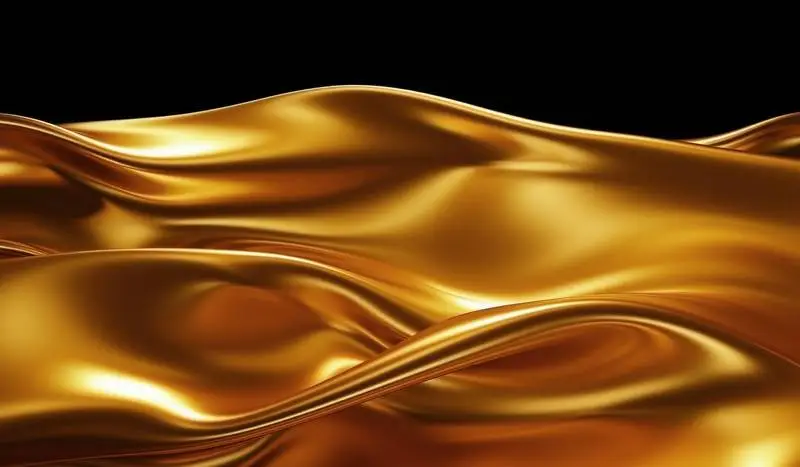 Texture of a Shiny Flowing Golden Foil on a Black Background