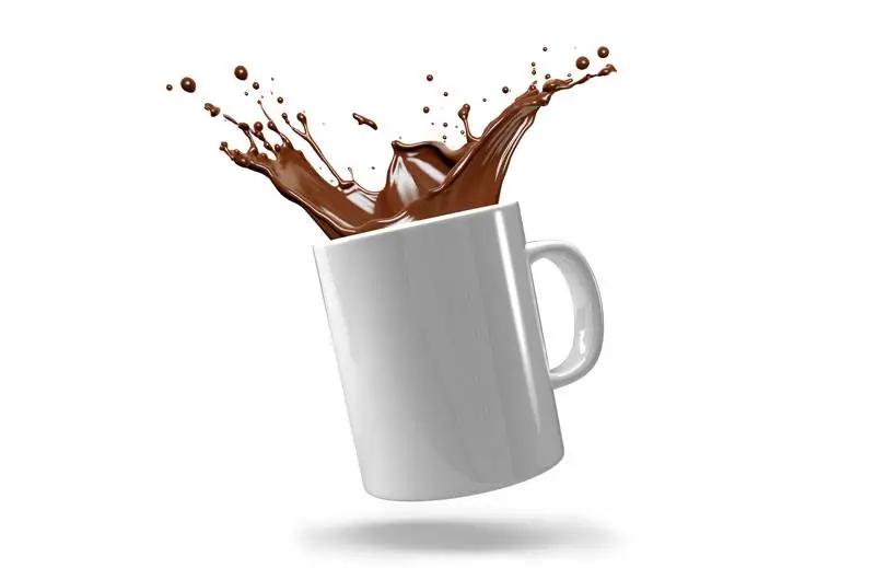 Image of White Mug with Coffee Splash on White Background