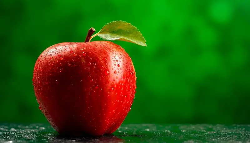 Image with Fresh Red Apple on Green Background