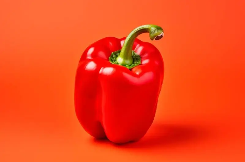 Realistic Image of a Red Pepper on a Colourful Background