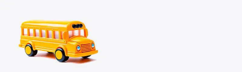 Blank Banner of a Yellow Toy School Bus in Profile on a White Background