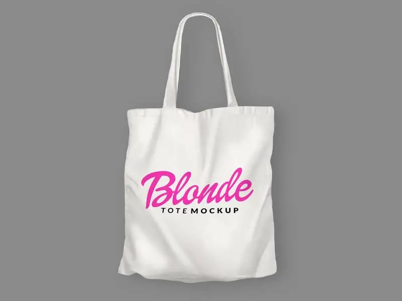 White Tote Bag with Blondie Logo on a Grey Surface