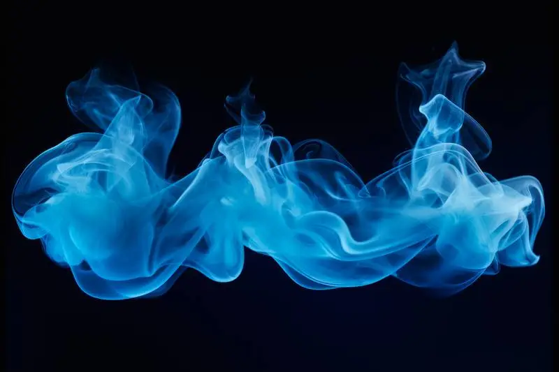Photo of Blue Smoke on a Black Background