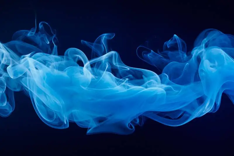 Photo of a Blue Smoke Plume on a Black Background