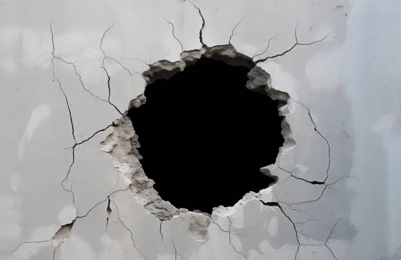 Cracked Wall Concrete with a Black Hole in the Middle