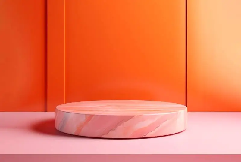 Round Pink Marble Podium on an Orange Abstract Background