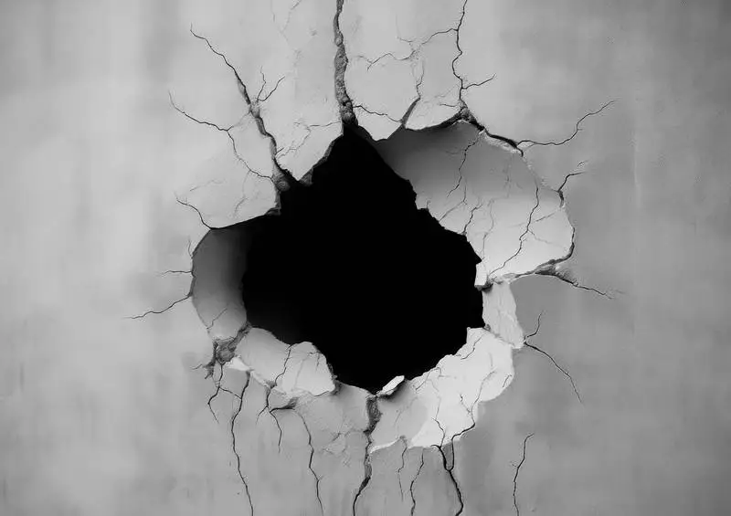 Photo of a Black Hole on a Concrete Wall