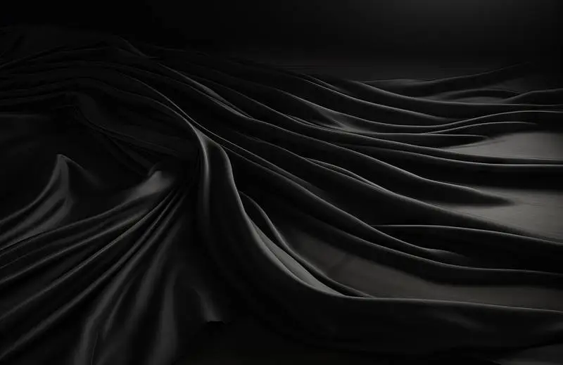 Photo of Silky Black Fabric on a Black Background