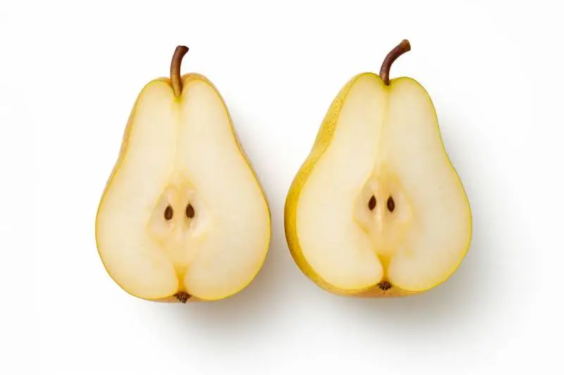 Picture of a Pear Cut in Half on a White Background Front View