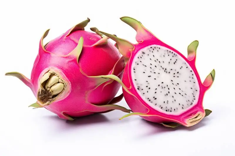 Picture of a Dragon Fruit Cut in Half on a White Background