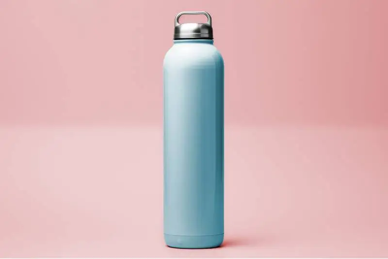 Minimalist Photo of Metallic Turquoise Thermos Bottle on Light Pink Background