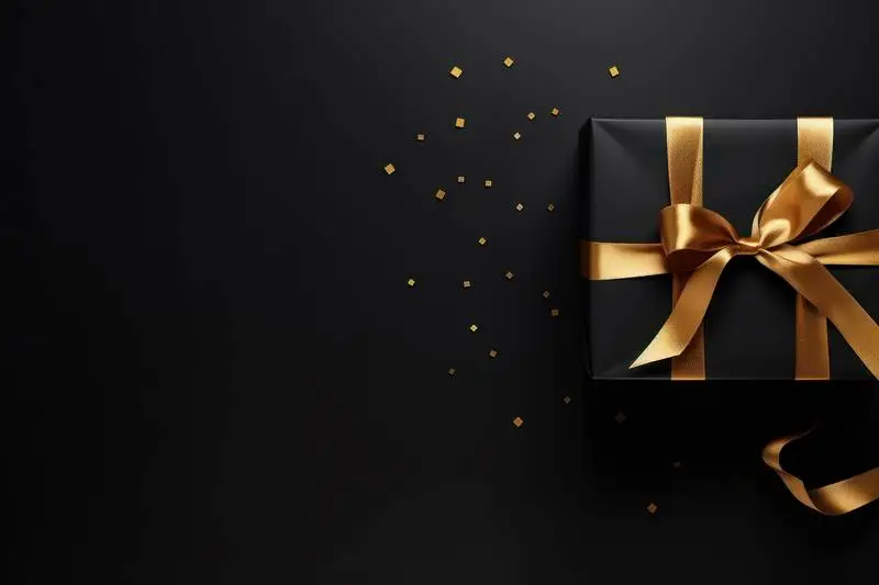 Black Box Banner with Gold Ribbon on a Dark Background