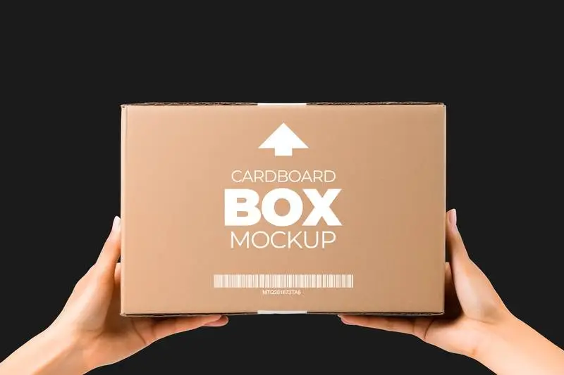 Mockup of Label on Cardboard Box Held by Two Hands