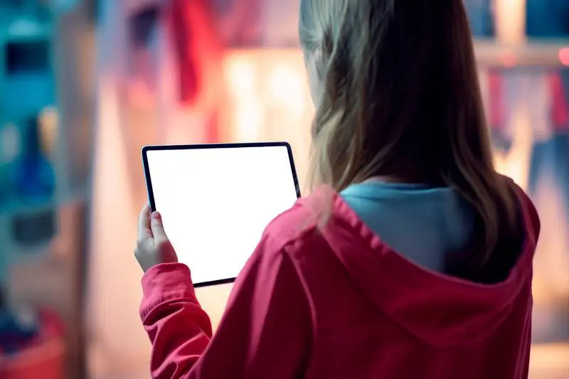Blank Image of Back View Girl Holding Tablet Pro