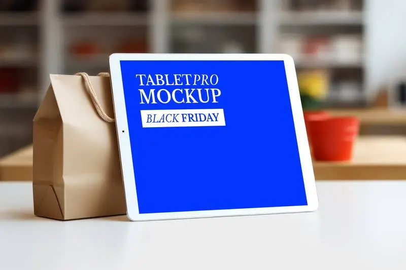 Screen Mockup of a Pro Tablet on a Paper Bag on a Desk