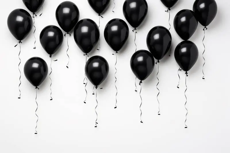 Image of White Wall With Collection of Black Balloons