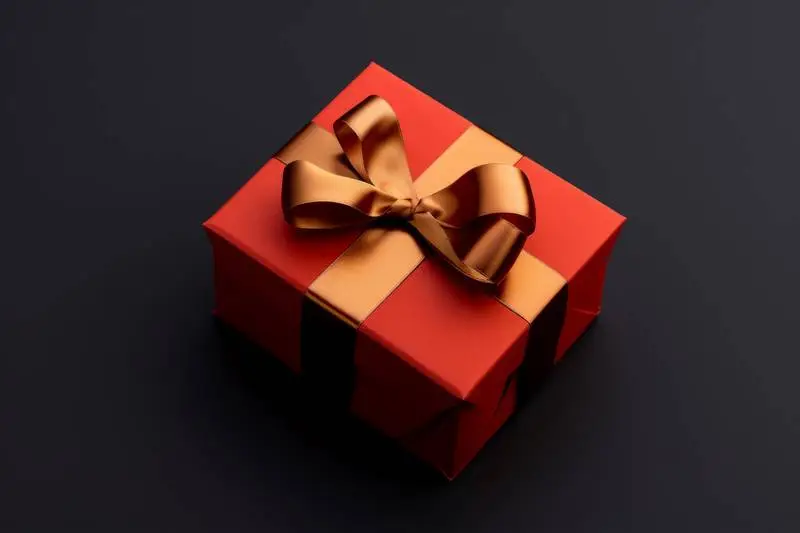 Red Box Banner With Gold Ribbon on a Dark Background