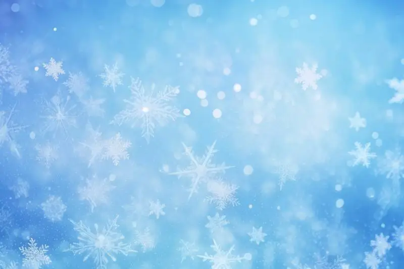 Image of Snowflakes Blurred on a Blue Background