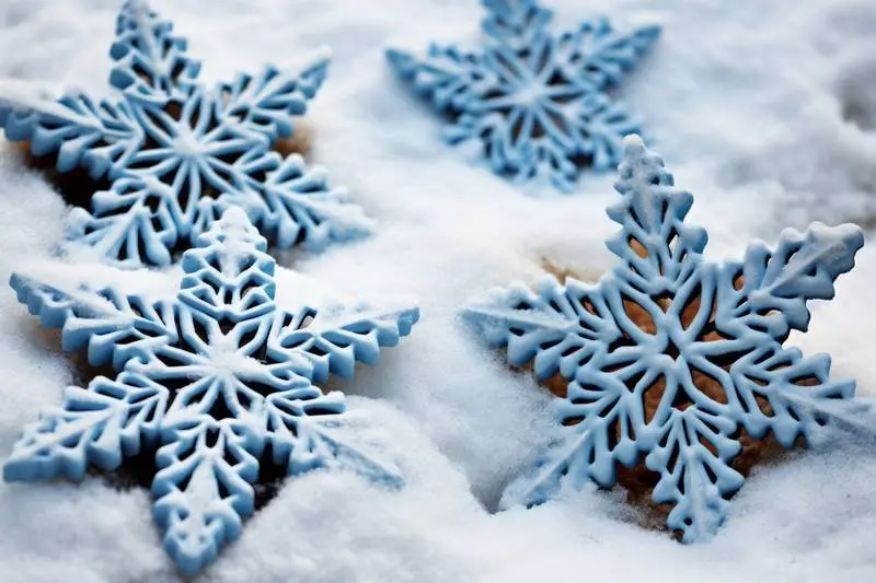 Image of White 3D Christmas Stars on a Snowy Background