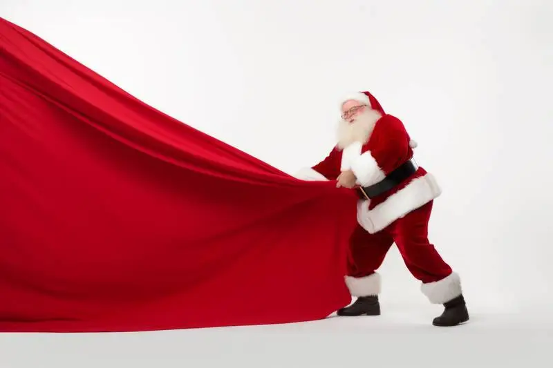 Image of St. Klauss Pulling a Red Curtain on a White Background