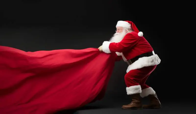 Image of St. Klauss Pulling a Red Curtain on a Dark Background