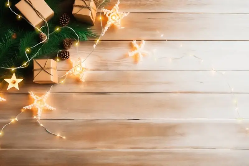 Image of Christmas Scene With Decoration of Branches and Lights on Wooden Background