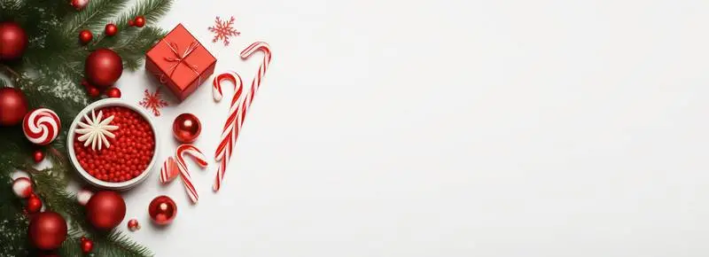 Image With Christmas Decoration of Branches and Candy Canes on a White Background