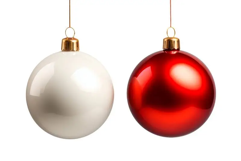 A Red and a White Christmas Balls Hanging on a Totally White Background