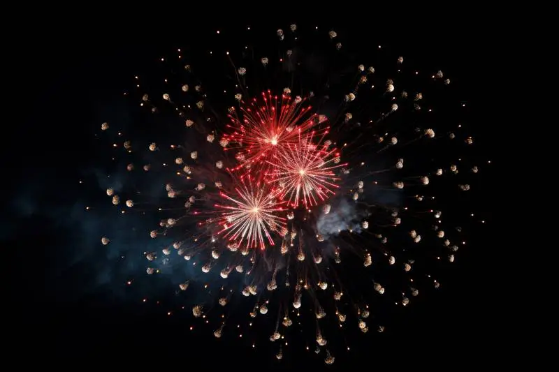 Image of Red and Blue Fireworks on a Black Background